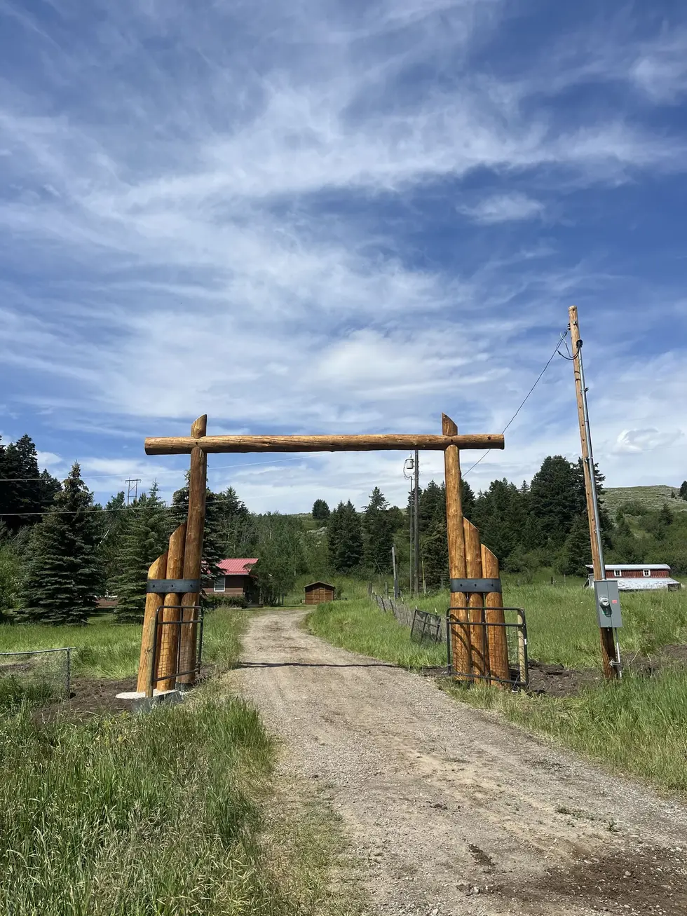 Quinn Creek Log Archway — Quinn Creek, by Montana Ranch & Land Improvement Service