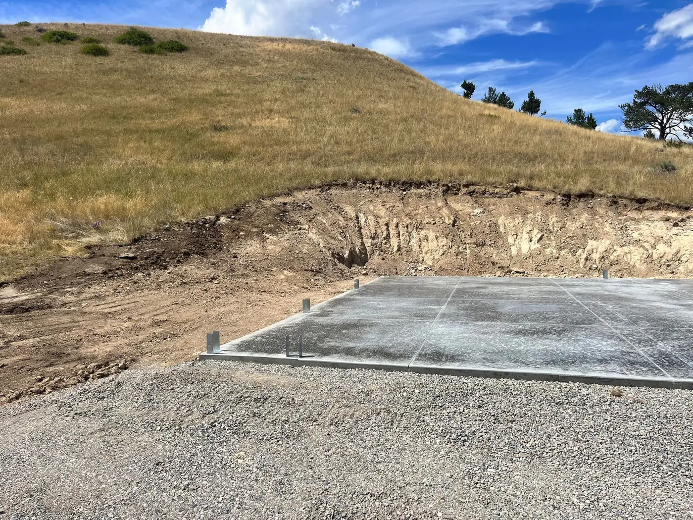 Concrete flatwork being finished on a Montana ranch project