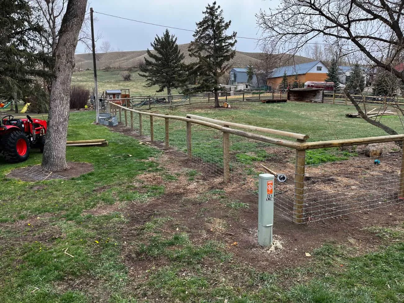 Wire fence line running across Montana pasture