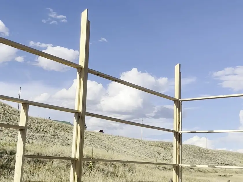 Pole barn posts tied together with horizontal girts