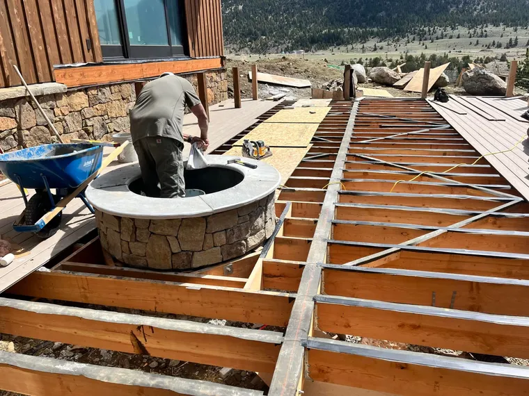 Stone Fire Pit on a Composite Deck, by Montana Ranch & Land Improvement Service