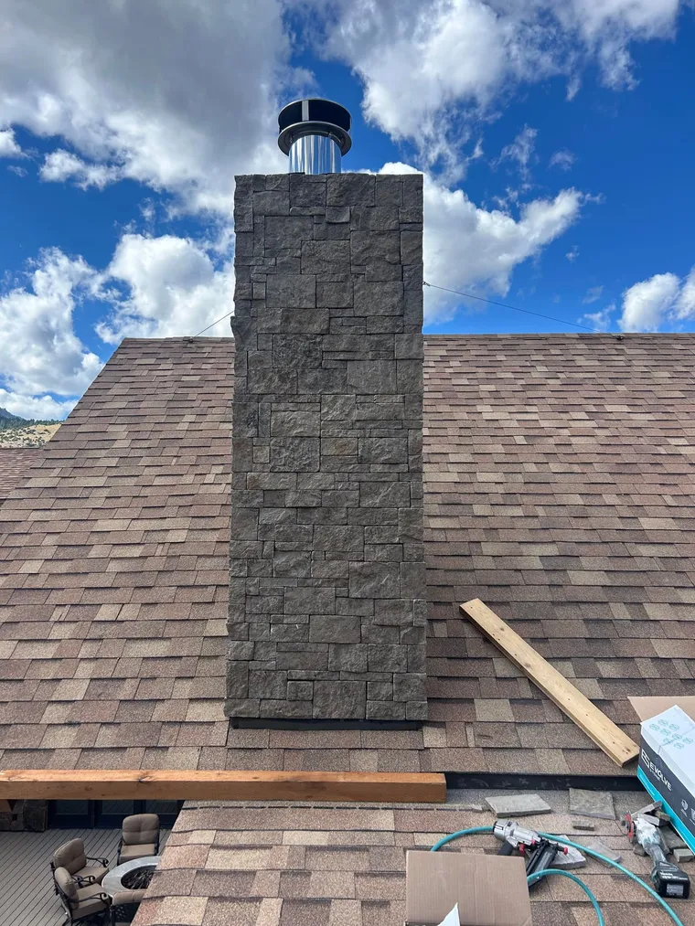 Stone Veneer Chimney Wrap, by Montana Ranch & Land Improvement Service